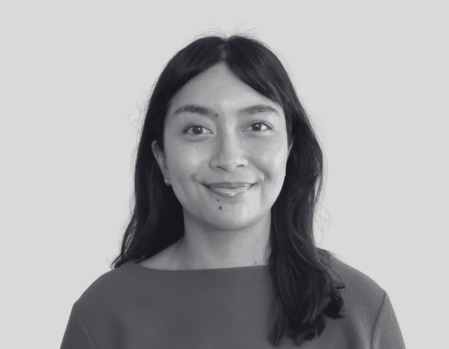 Black and white headshot of Jess Jackson - Dark haired person in a sweater
