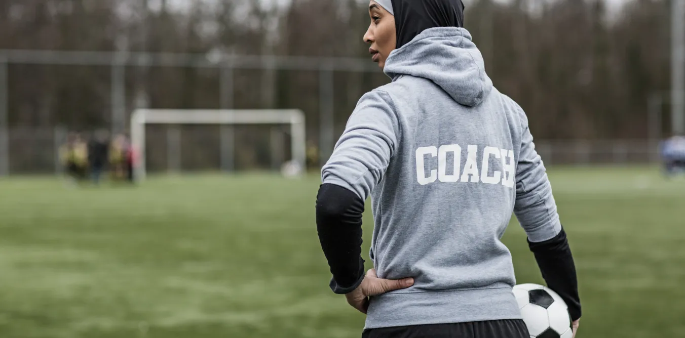Photo of football coach on field
