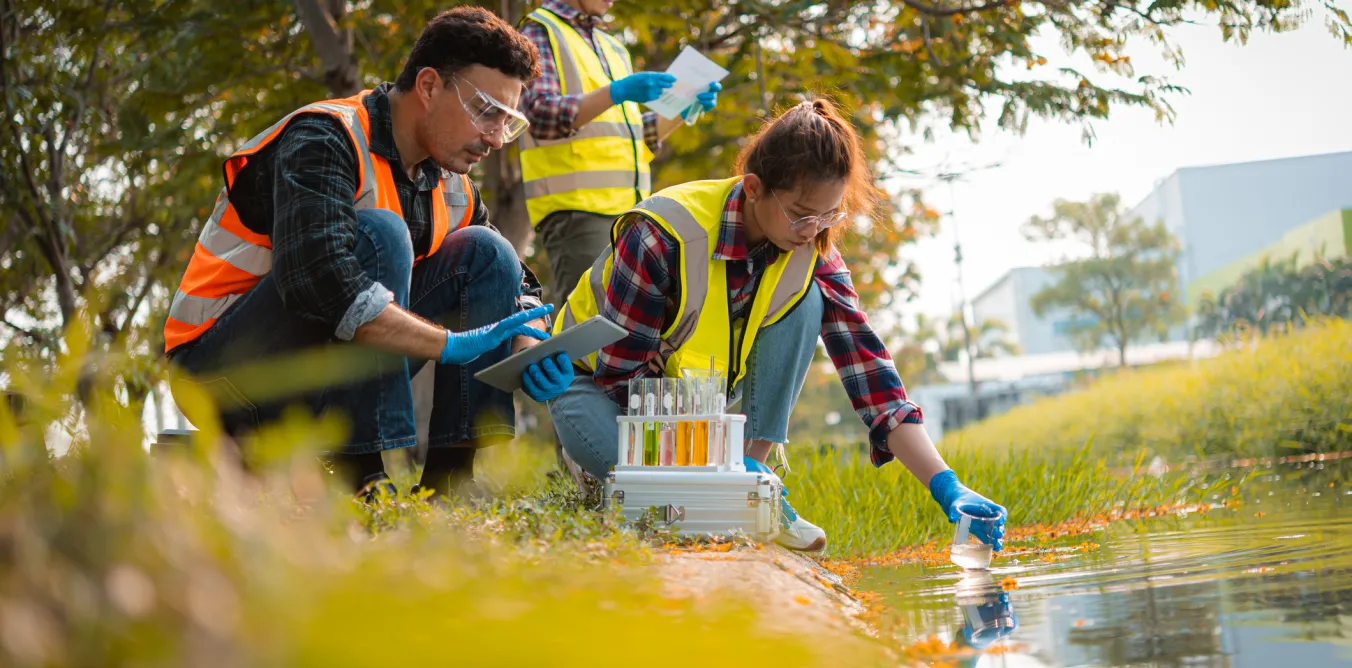 Photo of students testing water quality in the countryside