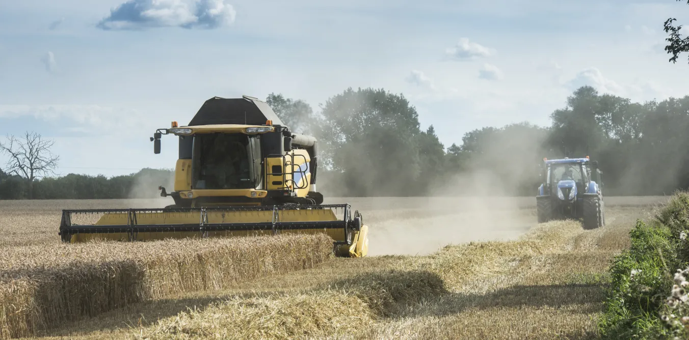 Photo of combine harvester operating in a field