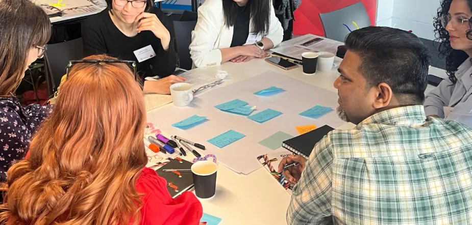 Doctoral students taking part in group activity
