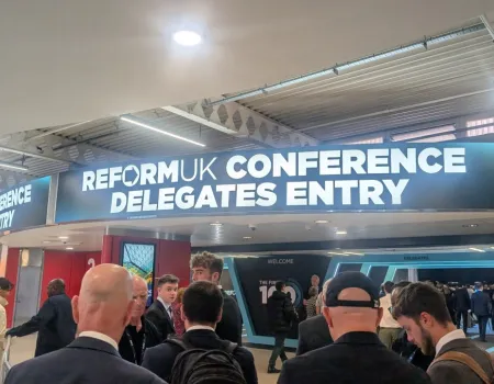 An image of a sign from Reform UK Conference reading 'delegate entry'