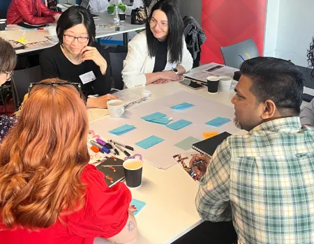 Doctoral students taking part in group activity