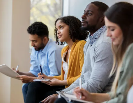 A group of students listening