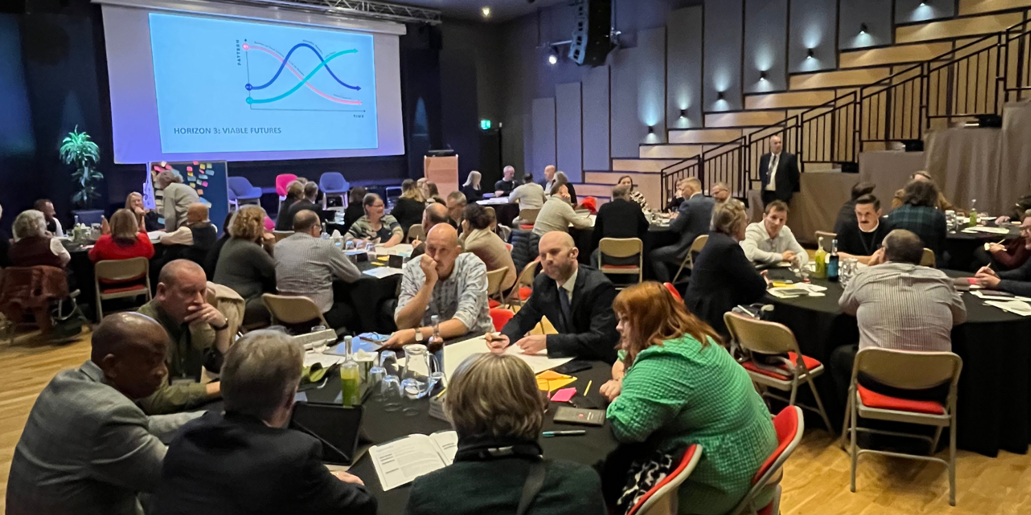 Participants at tables at GuildHE conference 2024